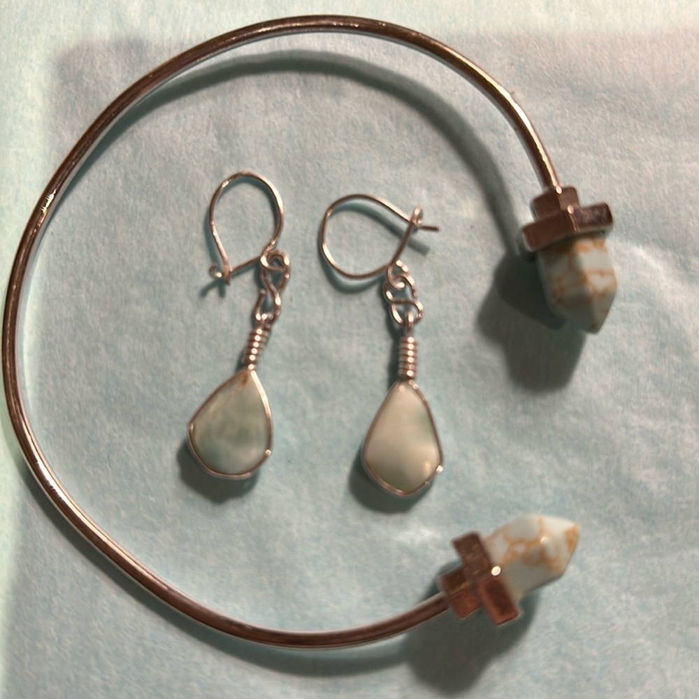 Silver bracelet and earrings set with light turquoise stones